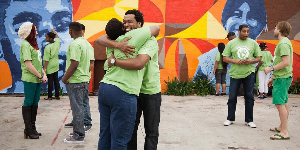 a group of volunteers hugging