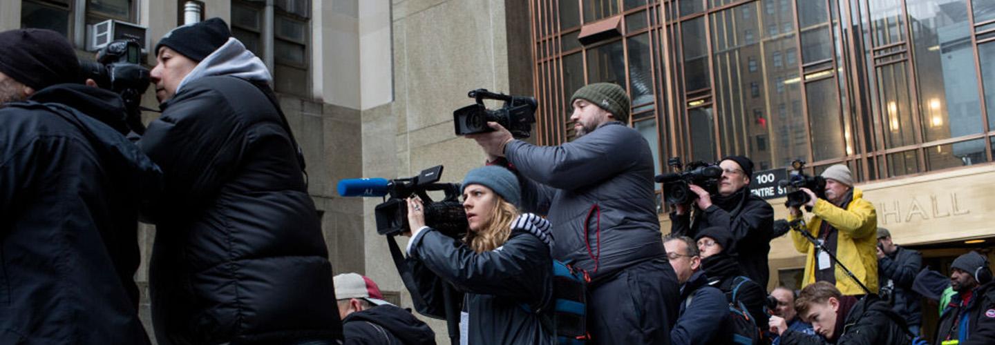 news media outside of a courthouse