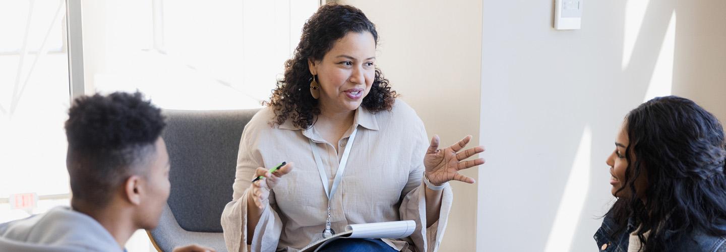 a teacher talks to her students