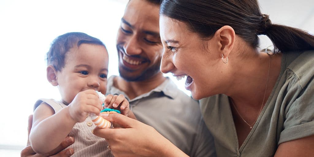 parents hold their child