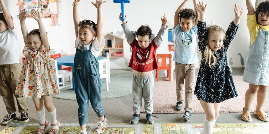a group of children dance