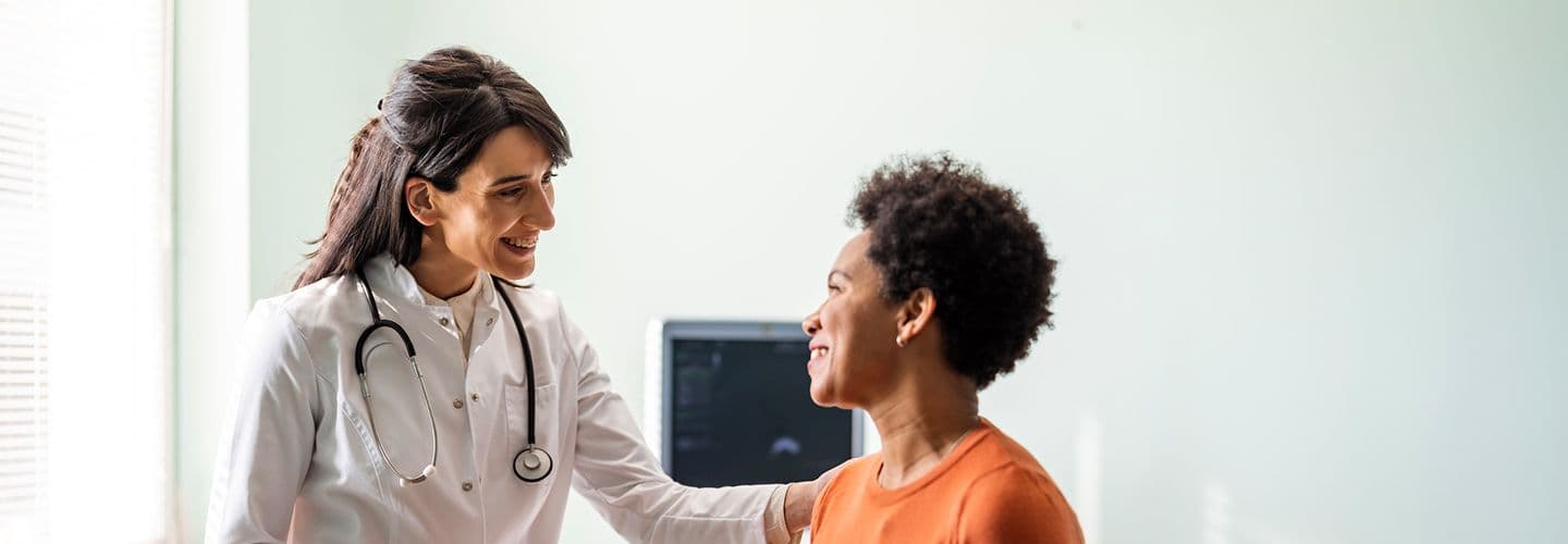 a doctor talks to her patient